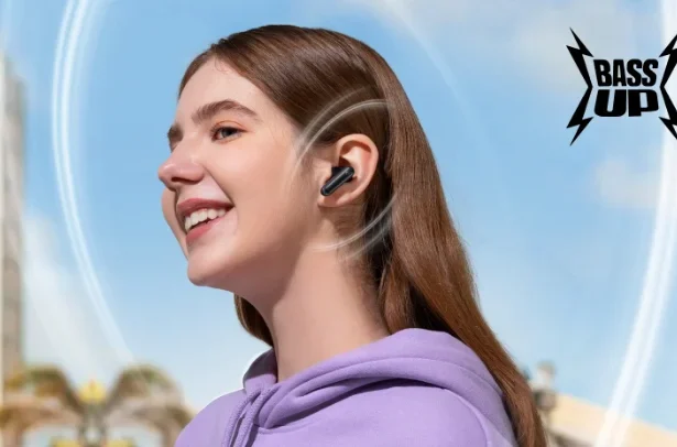 Young woman smiling while wearing true wireless earbuds outdoors, with sound waves illustrated around her ear.