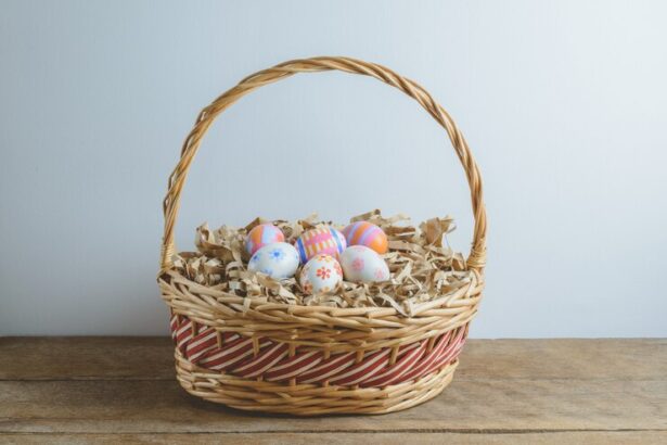 Woven wicker basket filled with colorful Easter eggs and shredded paper, resting on a wooden surface.